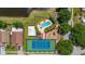 Overhead shot featuring a pool, tennis court, playground, and lake within the community at 2146 Fish Eagle St, Clermont, FL 34714