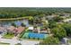 Aerial view of community amenities including a pool, tennis court, and playground at 2146 Fish Eagle St, Clermont, FL 34714