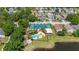 Aerial view showcases community pool, tennis court, lake, playground, and pavilion at 2146 Fish Eagle St, Clermont, FL 34714