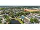 Aerial view of neighborhood with community amenities including pool and tennis courts at 2146 Fish Eagle St, Clermont, FL 34714