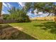 Expansive back yard with wooden fence and mature trees provides privacy at 2146 Fish Eagle St, Clermont, FL 34714