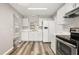 Well-equipped kitchen features modern appliances, white cabinets, and ample counter space at 2146 Fish Eagle St, Clermont, FL 34714