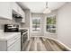 Bright kitchen area features stainless steel appliances, a cozy nook, and ample natural light at 2146 Fish Eagle St, Clermont, FL 34714