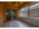 This screened lanai features tile flooring and a ceiling fan at 2146 Fish Eagle St, Clermont, FL 34714