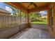 A screened patio with tile flooring provides a peaceful outdoor space with views of the backyard at 2146 Fish Eagle St, Clermont, FL 34714