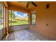 A screened patio with tile flooring providing an outdoor space with views of the backyard at 2146 Fish Eagle St, Clermont, FL 34714