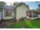 Charming home exterior with a screened patio and well-maintained yard at 2225 Maryday Ct, Orlando, FL 32812