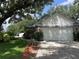 Single-story home boasts an attached two-car garage, landscaped yard, and charming curb appeal at 2225 Maryday Ct, Orlando, FL 32812