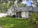 Charming single-Gathering home featuring a well-manicured lawn, lush landscaping, and inviting curb appeal at 2225 Maryday Ct, Orlando, FL 32812
