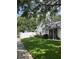 Well-maintained home with lovely curb appeal, featuring green lawn and decorative fence along the property line at 2225 Maryday Ct, Orlando, FL 32812