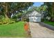 This home has a two-car garage and is beautifully landscaped, creating a very welcoming curb appeal at 2225 Maryday Ct, Orlando, FL 32812