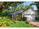 This lovely home has a two-car garage and is beautifully landscaped, creating a very welcoming curb appeal at 2225 Maryday Ct, Orlando, FL 32812