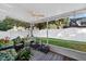 Relaxing screened-in patio with comfortable seating and a view of the backyard at 2225 Maryday Ct, Orlando, FL 32812