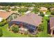 Aerial view of the home showing the rear of the house and screened in lanai at 271 Indian Wells Ave, Poinciana, FL 34759