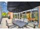 Outdoor patio with dining table and umbrella, ideal for enjoying outdoor meals and relaxation at 271 Indian Wells Ave, Poinciana, FL 34759