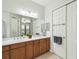 Bathroom with double vanity, a large mirror, and good natural lighting at 271 Indian Wells Ave, Poinciana, FL 34759