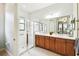 Bathroom featuring double vanity, glass shower, and nice modern finishes at 271 Indian Wells Ave, Poinciana, FL 34759