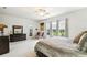 Bright bedroom featuring ample natural light and a comfortable sitting area at 271 Indian Wells Ave, Poinciana, FL 34759
