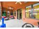 Cozy Florida room featuring wicker furniture and plants, perfect for enjoying natural light and a tranquil atmosphere at 271 Indian Wells Ave, Poinciana, FL 34759