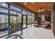 Inviting Florida room with tiled floor and plenty of natural light, perfect for indoor-outdoor living at 271 Indian Wells Ave, Poinciana, FL 34759
