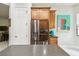Well-equipped kitchen area with stainless steel refrigerator and ample cabinet space at 271 Indian Wells Ave, Poinciana, FL 34759