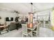 Open concept kitchen and living area featuring a tile floor, dining table, and bar seating at 271 Indian Wells Ave, Poinciana, FL 34759