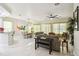 Bright and open-concept living and dining area features tile flooring and modern decor at 271 Indian Wells Ave, Poinciana, FL 34759