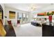Spacious primary bedroom with ceiling fan, sitting area and stylish decor at 271 Indian Wells Ave, Poinciana, FL 34759