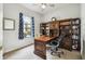 This home office features a built-in bookcase, a ceiling fan, and a window at 271 Indian Wells Ave, Poinciana, FL 34759