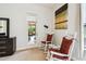 Comfortable sitting area with rocking chairs and view to lanai and outdoors at 271 Indian Wells Ave, Poinciana, FL 34759