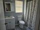 Cozy bathroom featuring standard fixtures, a shower and a vanity at 2805 Rodeo Dr, Kissimmee, FL 34746