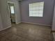 Bright bedroom featuring tile flooring, a window, and neutral walls at 2805 Rodeo Dr, Kissimmee, FL 34746