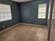 Bedroom featuring two windows, neutral walls, and tile flooring at 2805 Rodeo Dr, Kissimmee, FL 34746