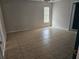 Bedroom featuring tile flooring and a window, providing ample natural light at 2805 Rodeo Dr, Kissimmee, FL 34746