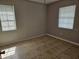 Bedroom featuring neutral walls, tile flooring, and a window at 2805 Rodeo Dr, Kissimmee, FL 34746