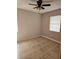 Bedroom with tiled floors, ceiling fan, and natural light from a window at 2805 Rodeo Dr, Kissimmee, FL 34746