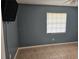 A cozy bedroom featuring tile flooring, a mounted tv and a window at 2805 Rodeo Dr, Kissimmee, FL 34746