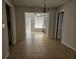 Dining room with tile flooring and an elegant chandelier at 2805 Rodeo Dr, Kissimmee, FL 34746