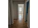 Hallway with neutral paint and wood flooring at 2805 Rodeo Dr, Kissimmee, FL 34746