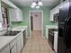 Bright kitchen featuring white cabinets and modern stainless steel appliances at 2805 Rodeo Dr, Kissimmee, FL 34746