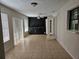 Living room with tile flooring, ceiling fan and sliding glass door at 2805 Rodeo Dr, Kissimmee, FL 34746