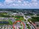 Aerial view showing the property's location within the community near a highway, lakes, and shopping centers at 2939 Sera Bella Way, Kissimmee, FL 34744