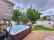 Private backyard with a relaxing hot tub and a hammock at 2939 Sera Bella Way, Kissimmee, FL 34744