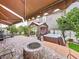 Spacious backyard oasis with brick-paved patio, gazebo, fire pit, and hot tub at 2939 Sera Bella Way, Kissimmee, FL 34744