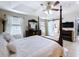 Bedroom with dark wood furniture and a sliding barn door at 2939 Sera Bella Way, Kissimmee, FL 34744