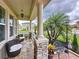 Inviting front porch with stone accents, decorative seating, and a welcoming entrance at 2939 Sera Bella Way, Kissimmee, FL 34744