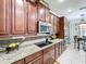 Well-lit kitchen featuring granite countertops, stainless steel appliances, and ample cabinet space at 2939 Sera Bella Way, Kissimmee, FL 34744