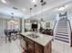 View of the open concept kitchen island leading to the dining room and Gathering room at 2939 Sera Bella Way, Kissimmee, FL 34744