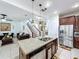 Modern kitchen island, with stainless steel appliances, stone countertops, and ample seating at 2939 Sera Bella Way, Kissimmee, FL 34744
