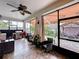 Comfortable lanai featuring outdoor kitchen, ceiling fans, and views of the private backyard with a gazebo at 2939 Sera Bella Way, Kissimmee, FL 34744
